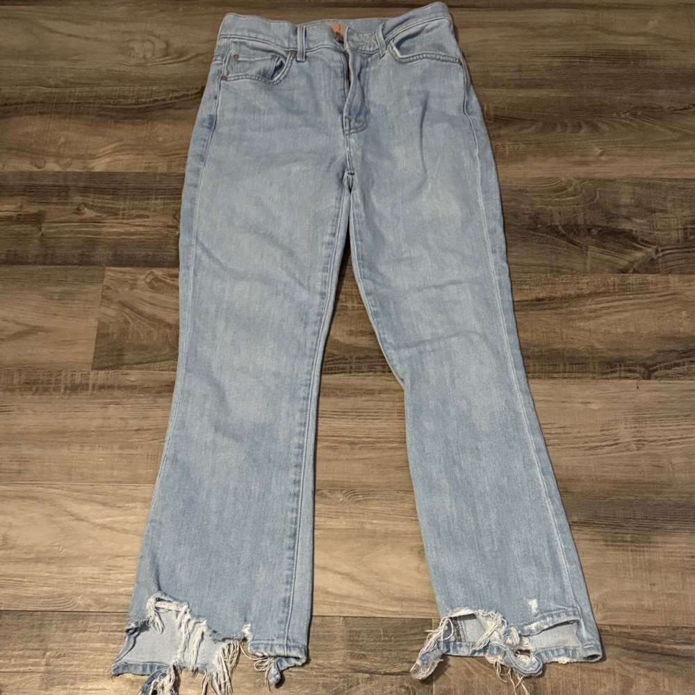MOTHER Light Blue Flare Jeans with Distressed Hem